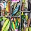 fishing lures and accessories in the box background